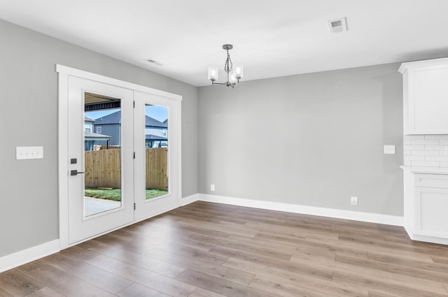 614 Woodrush Dr, Clarksville, TN 37040 - unfurnished dining area featuring a chandelier and light wood-style flooring