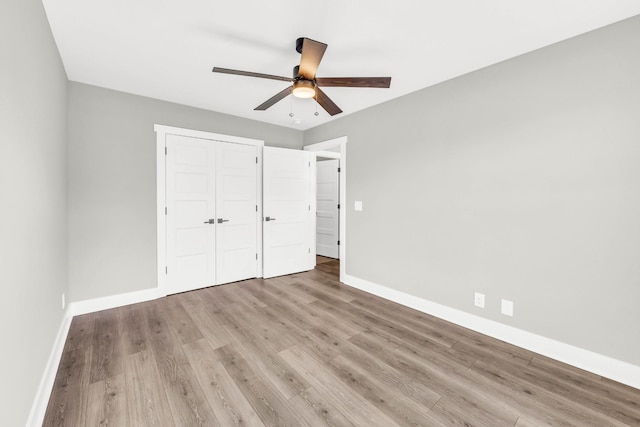 614 Woodrush Dr, Clarksville, TN 37040 - unfurnished bedroom featuring wood finished floors, a closet, and ceiling fan