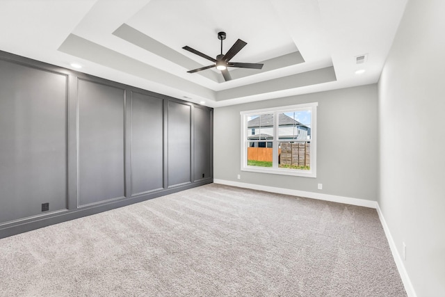 614 Woodrush Dr, Clarksville, TN 37040 - carpeted empty room with a raised ceiling and ceiling fan