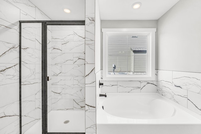 614 Woodrush Dr, Clarksville, TN 37040 - bathroom featuring a garden tub, a marble finish shower, and recessed lighting