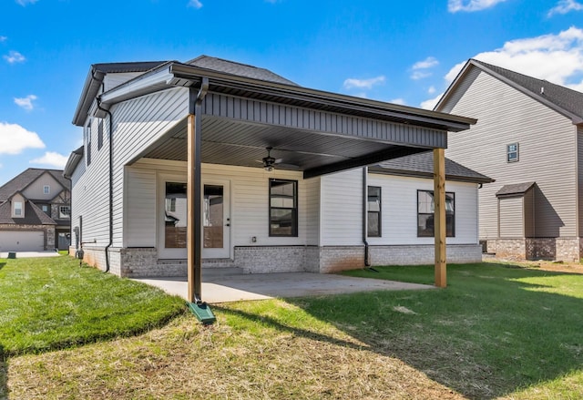 614 Woodrush Dr, Clarksville, TN 37040 - back of property with a ceiling fan, a lawn, and a patio area
