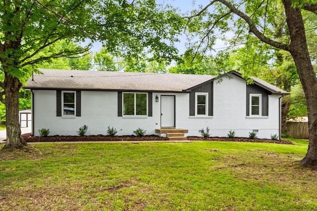 700 Hickerson Dr, White House, TN 37188 - ranch-style house featuring brick siding, crawl space, a shingled roof, a storage unit, and an outbuilding