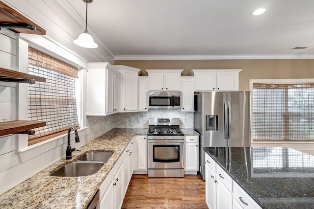 1317 Sam Houston Ave, Murfreesboro, TN 37129 - kitchen featuring stainless steel appliances, a sink, white cabinets, tasteful backsplash, and ornamental molding