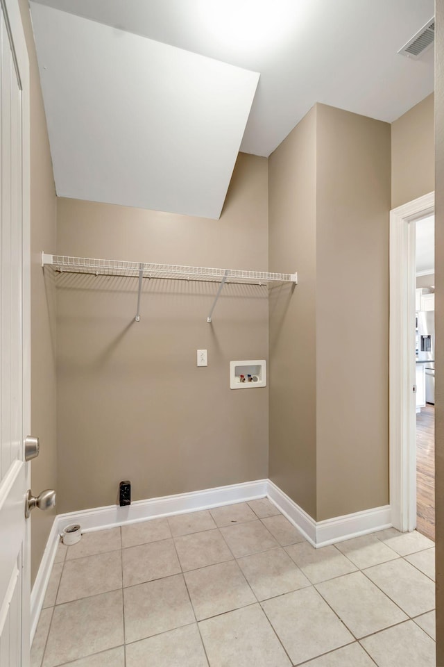 1317 Sam Houston Ave, Murfreesboro, TN 37129 - clothes washing area featuring hookup for a washing machine, baseboards, and light tile patterned floors