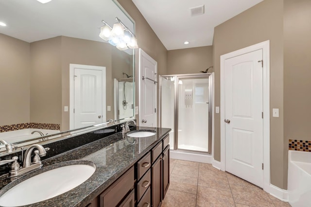 1317 Sam Houston Ave, Murfreesboro, TN 37129 - bathroom with a bath, a shower stall, tile patterned floors, baseboards, and double vanity