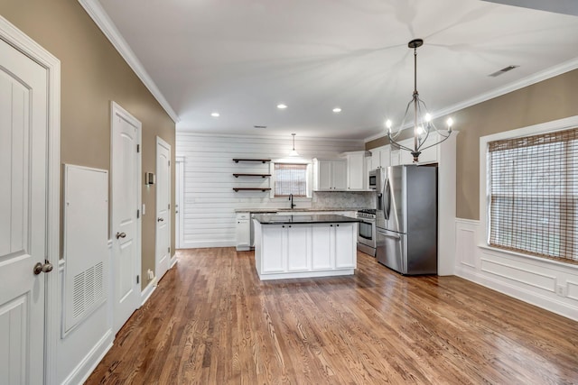 1317 Sam Houston Ave, Murfreesboro, TN 37129 - kitchen with appliances with stainless steel finishes, ornamental molding, open shelves, dark countertops, and white cabinets