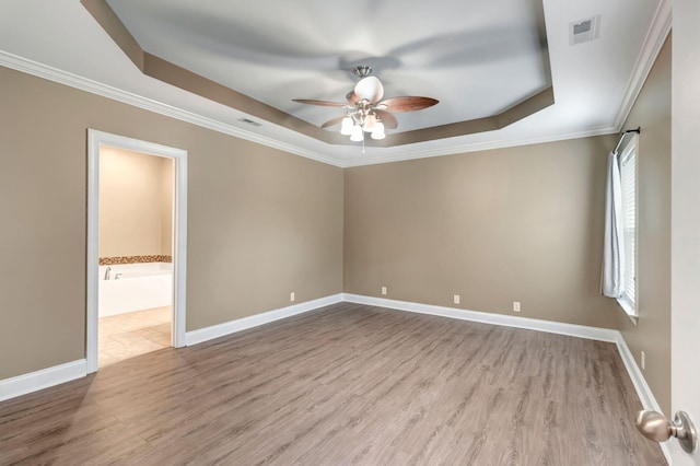 1317 Sam Houston Ave, Murfreesboro, TN 37129 - unfurnished room featuring a tray ceiling, a ceiling fan, wood finished floors, crown molding, and baseboards