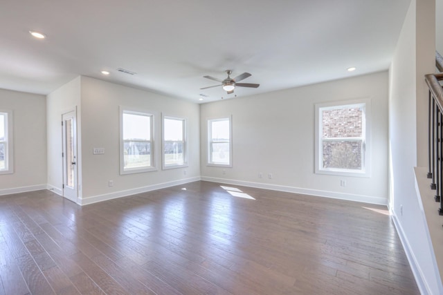 unfurnished living room featuring a ceiling fan, baseboards, dark wood-style floors, and recessed lighting