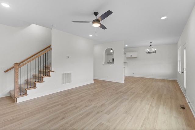 1 Shelton Ferry Rd, Southside, TN 37171 - unfurnished living room with ceiling fan, light wood-style flooring, stairway, a chandelier, and recessed lighting