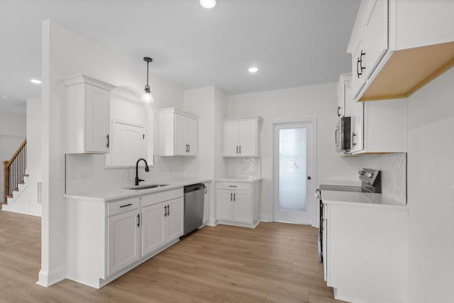 1 Shelton Ferry Rd, Southside, TN 37171 - kitchen with a sink, stainless steel appliances, light wood-style floors, white cabinetry, and recessed lighting