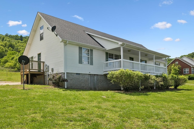 back of house with a lawn, roof with shingles, crawl space, and a porch