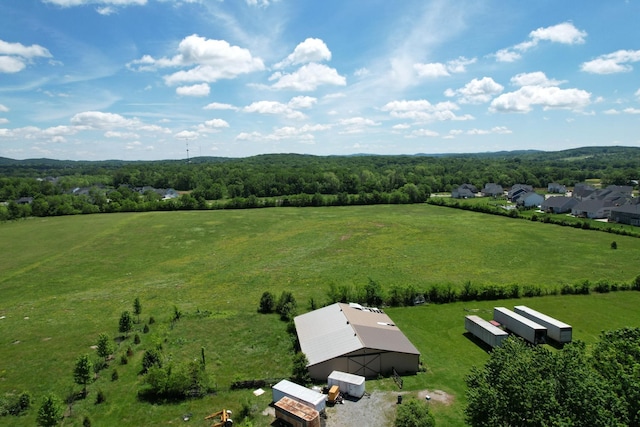 aerial view of sparsely populated area featuring a heavily wooded area
