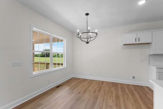 2214 S Hinton Rd, Southside, TN 37171 - unfurnished dining area with light wood-style flooring, a chandelier, baseboards, and recessed lighting