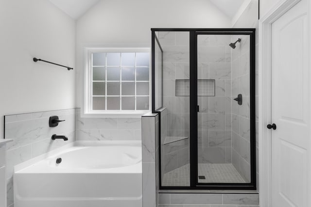 2214 S Hinton Rd, Southside, TN 37171 - bathroom featuring vaulted ceiling, a stall shower, and a bath