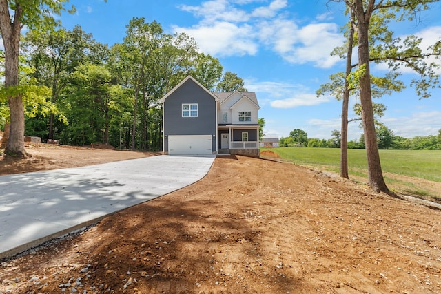 2214 S Hinton Rd, Southside, TN 37171 - traditional home featuring an attached garage, driveway, and covered porch