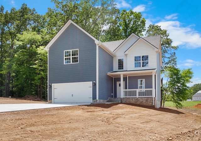 2214 S Hinton Rd, Southside, TN 37171 - view of front of house featuring covered porch, a garage, and driveway