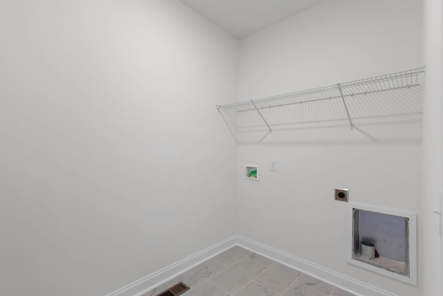 2214 S Hinton Rd, Southside, TN 37171 - clothes washing area with electric dryer hookup, baseboards, washer hookup, and light marble finish floors