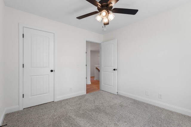 2214 S Hinton Rd, Southside, TN 37171 - unfurnished bedroom featuring carpet flooring, baseboards, and a ceiling fan