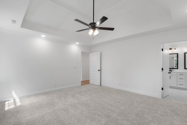 2214 S Hinton Rd, Southside, TN 37171 - spare room with a tray ceiling, ceiling fan, light carpet, recessed lighting, and crown molding
