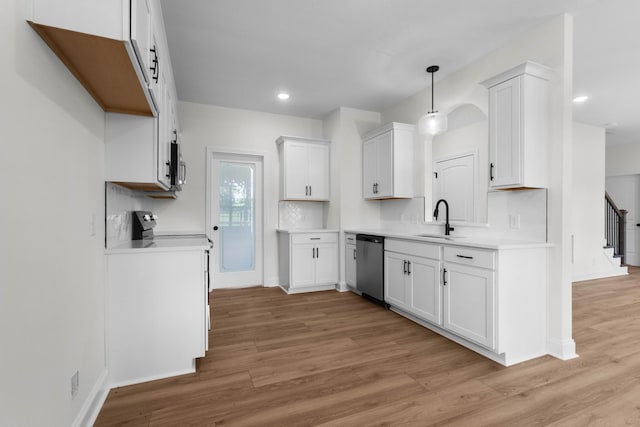 2214 S Hinton Rd, Southside, TN 37171 - kitchen featuring appliances with stainless steel finishes, light wood finished floors, white cabinets, a sink, and recessed lighting
