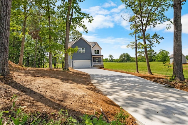 2214 S Hinton Rd, Southside, TN 37171 - traditional-style house with driveway, an attached garage, and a front lawn