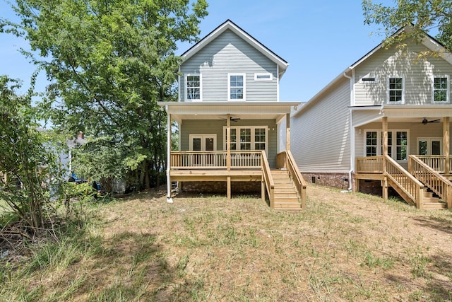 rear view of house with a ceiling fan, stairs, a wooden deck, and french doors