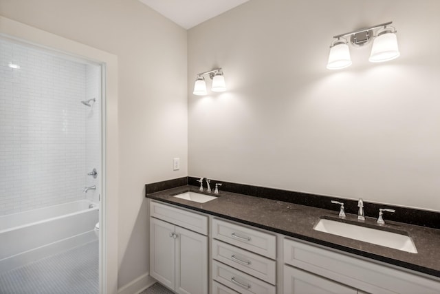 full bathroom with double vanity, shower / washtub combination, baseboards, and tile patterned flooring
