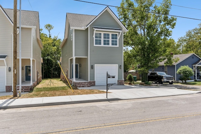 view of front of property featuring driveway and an attached garage