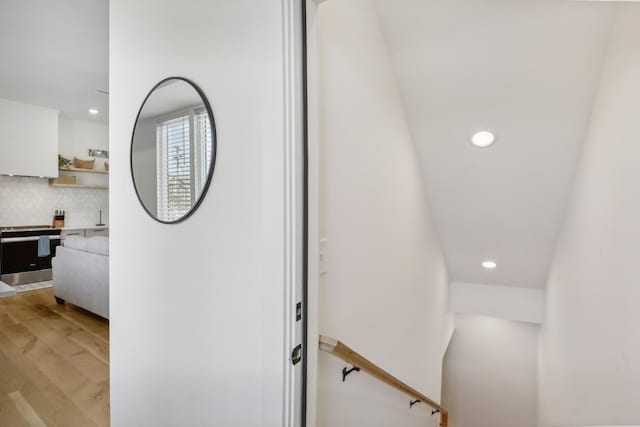 98 N 8th St, Nashville, TN 37206 - detailed view of recessed lighting, backsplash, wood finished floors, and stainless steel electric range oven