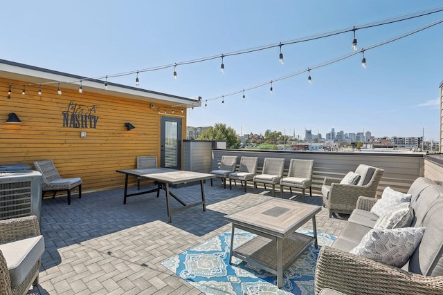 98 N 8th St, Nashville, TN 37206 - view of patio featuring outdoor lounge area, cooling unit, and a view of city