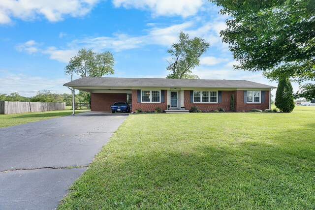 801 Lloyd St, Lawrenceburg, TN 38464 - single story home with driveway, an attached carport, and brick siding