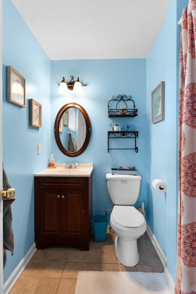 801 Lloyd St, Lawrenceburg, TN 38464 - full bath featuring toilet, vanity, tile patterned flooring, a textured ceiling, and baseboards