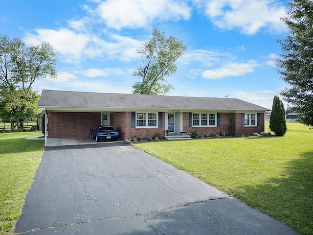 801 Lloyd St, Lawrenceburg, TN 38464 - single story home with asphalt driveway, brick siding, and a front lawn