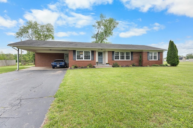 801 Lloyd St, Lawrenceburg, TN 38464 - ranch-style house featuring driveway, an attached carport, and brick siding