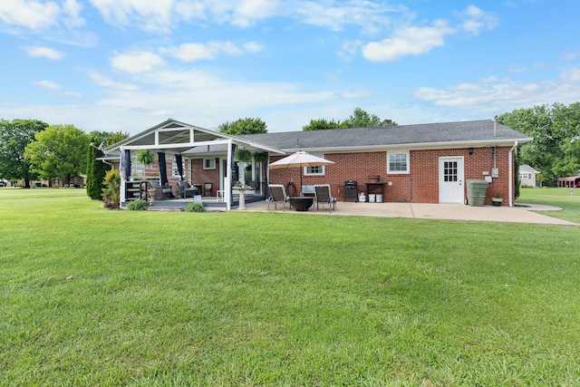 801 Lloyd St, Lawrenceburg, TN 38464 - back of property with a patio, a lawn, and brick siding
