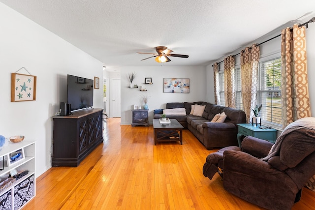 801 Lloyd St, Lawrenceburg, TN 38464 - living area featuring ceiling fan, light wood-type flooring, and a textured ceiling