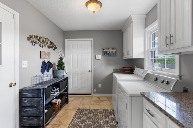 801 Lloyd St, Lawrenceburg, TN 38464 - washroom featuring washer and clothes dryer, cabinet space, baseboards, light tile patterned floors, and a textured ceiling