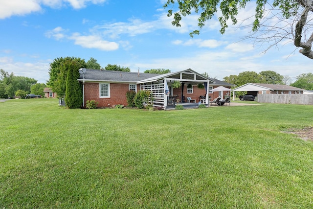 801 Lloyd St, Lawrenceburg, TN 38464 - rear view of property featuring brick siding, a detached carport, and a patio