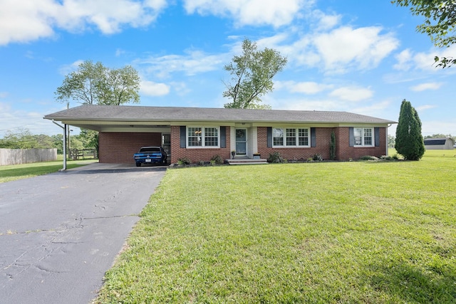 801 Lloyd St, Lawrenceburg, TN 38464 - ranch-style house featuring asphalt driveway, a carport, and brick siding