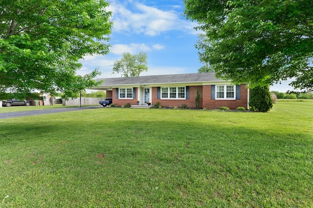 801 Lloyd St, Lawrenceburg, TN 38464 - single story home featuring driveway, a front lawn, brick siding, and an attached carport