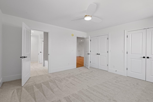 2208 Launcelot Rd, Chattanooga, TN 37421 - unfurnished bedroom featuring multiple closets, carpet, baseboards, and a ceiling fan