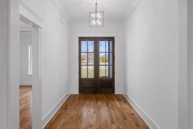 2208 Launcelot Rd, Chattanooga, TN 37421 - entryway with french doors, crown molding, wood finished floors, a chandelier, and baseboards