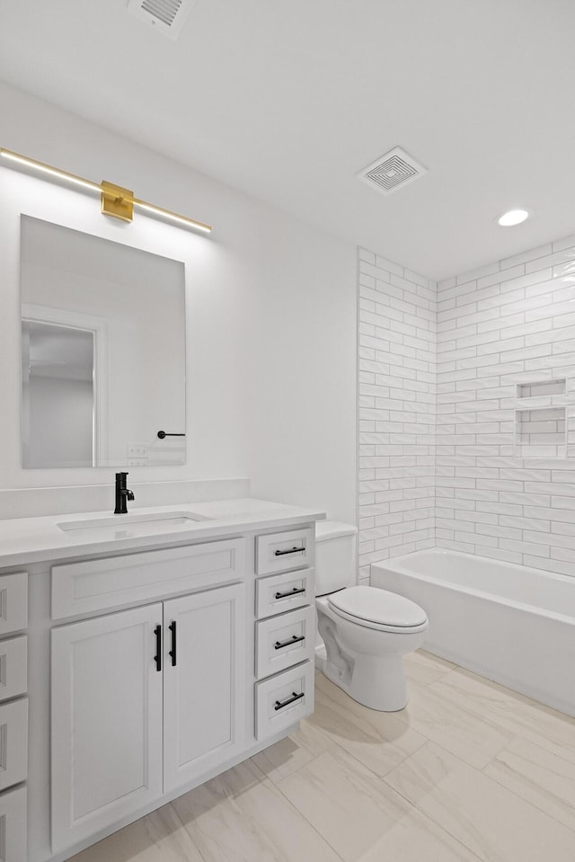 2208 Launcelot Rd, Chattanooga, TN 37421 - bathroom featuring vanity, toilet, marble look tiles, recessed lighting, and shower / bathtub combination
