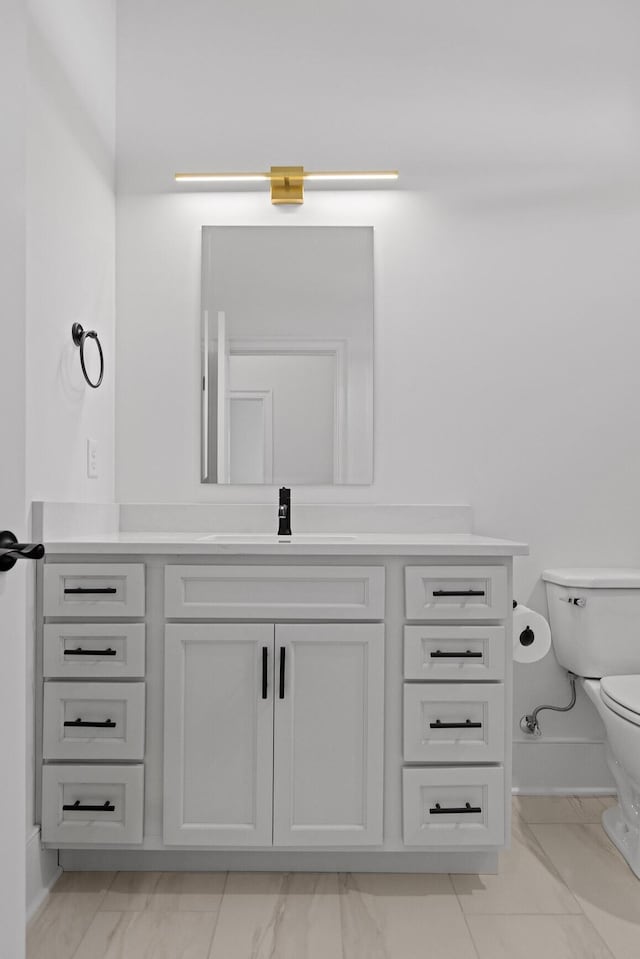 2208 Launcelot Rd, Chattanooga, TN 37421 - bathroom featuring marble finish flooring, toilet, vanity, and baseboards