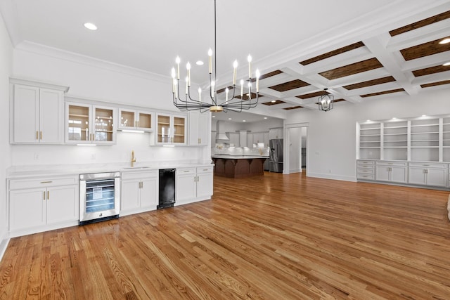 2208 Launcelot Rd, Chattanooga, TN 37421 - indoor wet bar featuring wine cooler, stainless steel fridge with ice dispenser, a chandelier, coffered ceiling, and beam ceiling