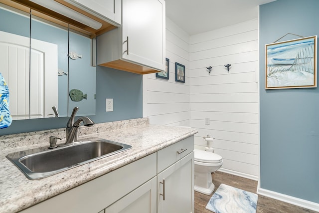 500 Mark Green Ct, Spring Hill, TN 37174 - full bath with vanity, wood finished floors, toilet, and wooden walls