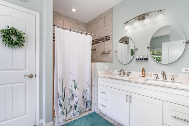 500 Mark Green Ct, Spring Hill, TN 37174 - bathroom featuring double vanity, a tile shower, and recessed lighting