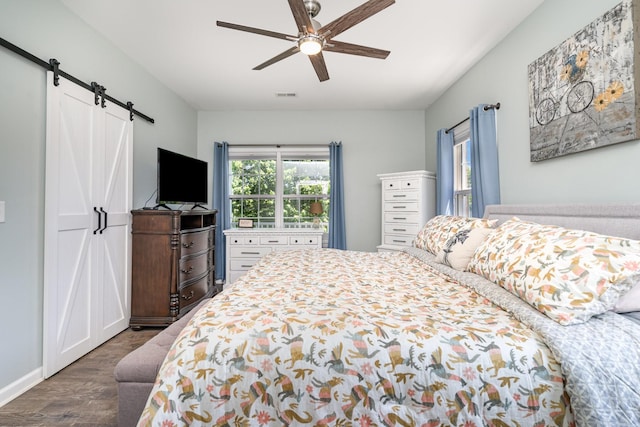 500 Mark Green Ct, Spring Hill, TN 37174 - bedroom with wood finished floors, a barn door, a ceiling fan, and baseboards