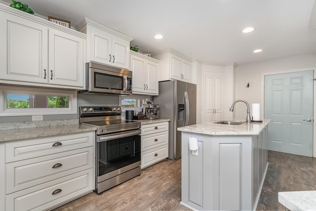 500 Mark Green Ct, Spring Hill, TN 37174 - kitchen featuring appliances with stainless steel finishes, a sink, white cabinetry, wood finished floors, and recessed lighting