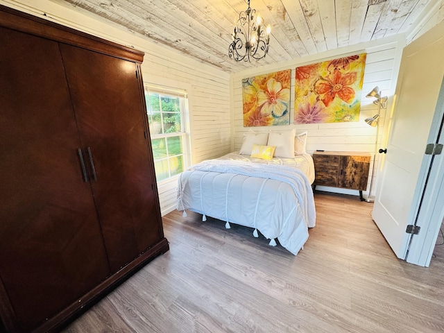 215 W College St, Bradford, TN 38316 - bedroom featuring wooden ceiling, wood finished floors, a chandelier, and wood walls
